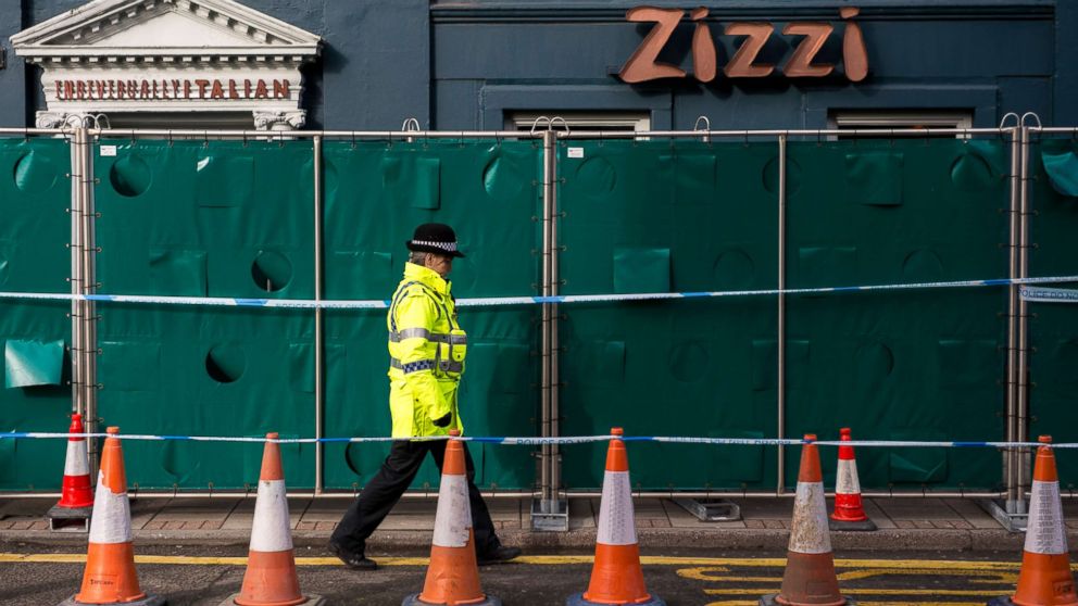 PHOTO: Police officers stand outside Zizzi restaurant as it remains closed as investigations continue into the poisoning of Sergei Skripal on March 11, 2018 in Salisbury, England.
