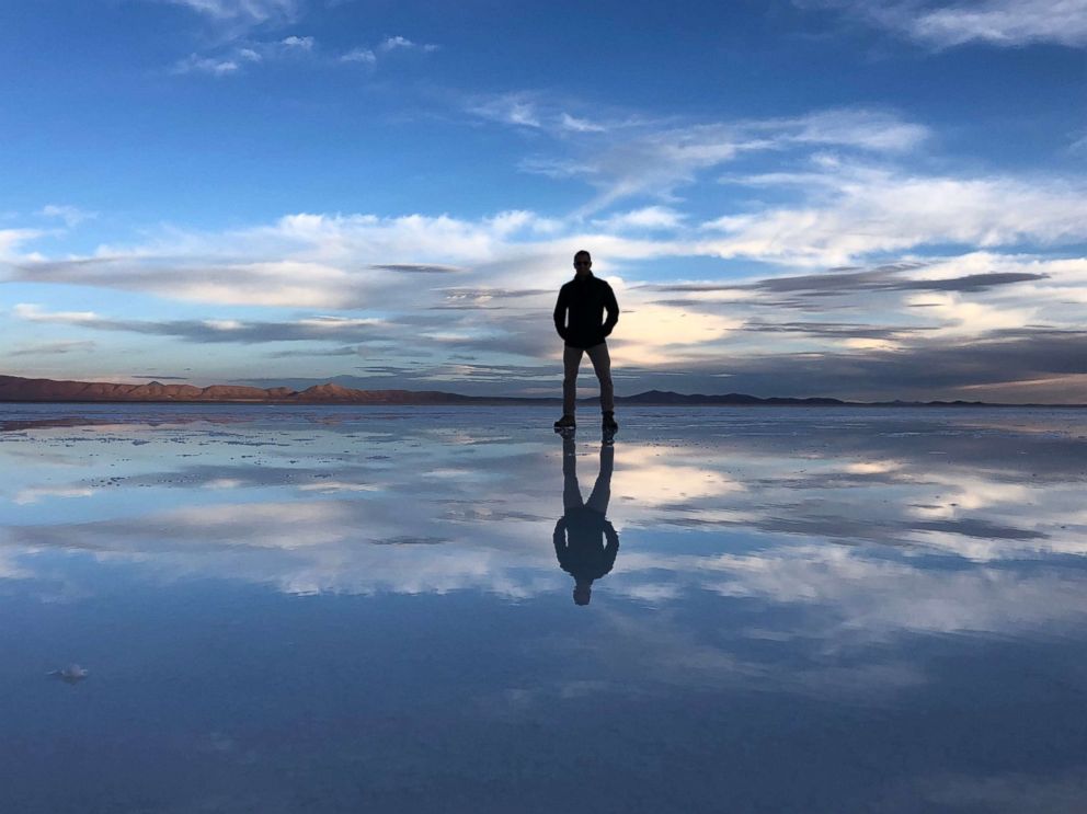 PHOTO: ABC News' Victor Oquendo stands by the reflection pool in the Salar where people take photos by the Bolivian salt flats.