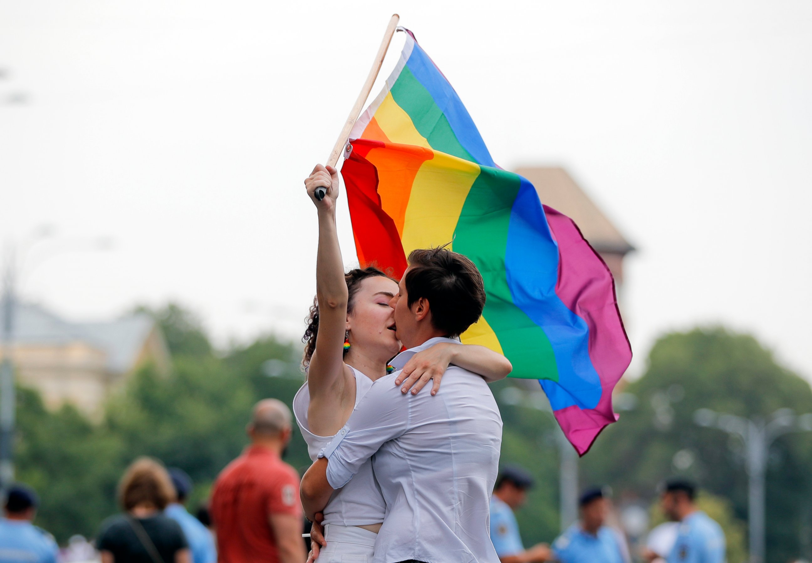 PHOTO: In this Saturday, June 9, 2018 file photo, two girls kiss holding a rainbow flag during the gay pride parade in Bucharest, Romania. Romania's top court has ruled that gay couples should have the same family rights as heterosexuals.