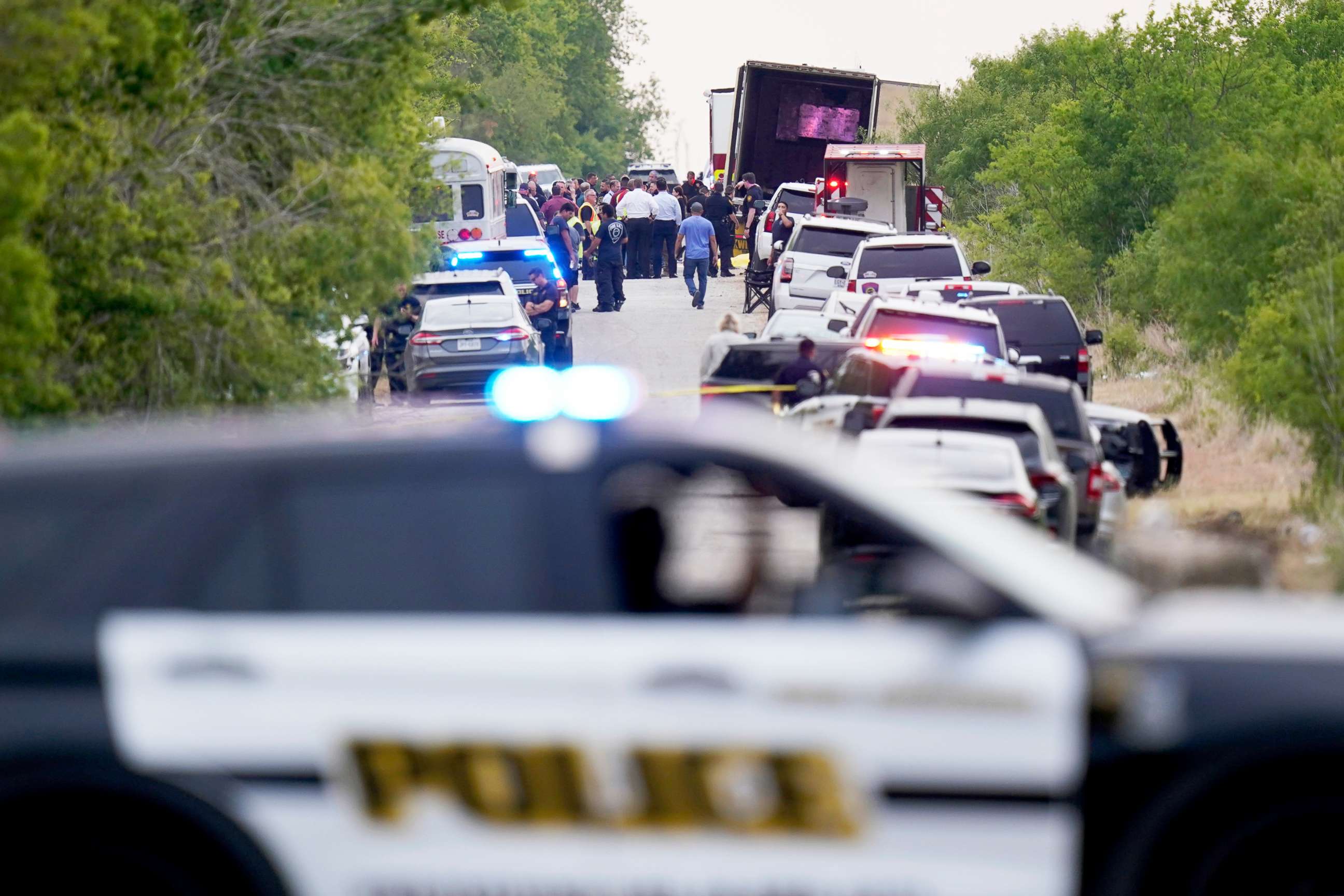 PHOTO: Police block the scene where a tractor trailer with multiple dead bodies was discovered in San Antonio, Texas June 27, 2022.
