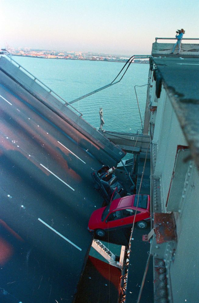 PHOTO: Rescue workers pull up car which was perched over section of bridge which collapsed in earthquake, in San Francisco, on Oct. 17, 1989.