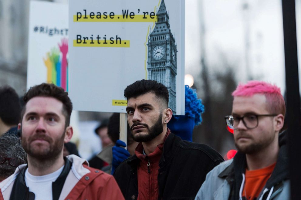 PHOTO: BeLeave and Cambridge Analytica whistleblowers Shahmir Sanni, center, and Chris Wylie, right, attend an emergency demonstration in Parliament Square on the anniversary of triggering Article 50.