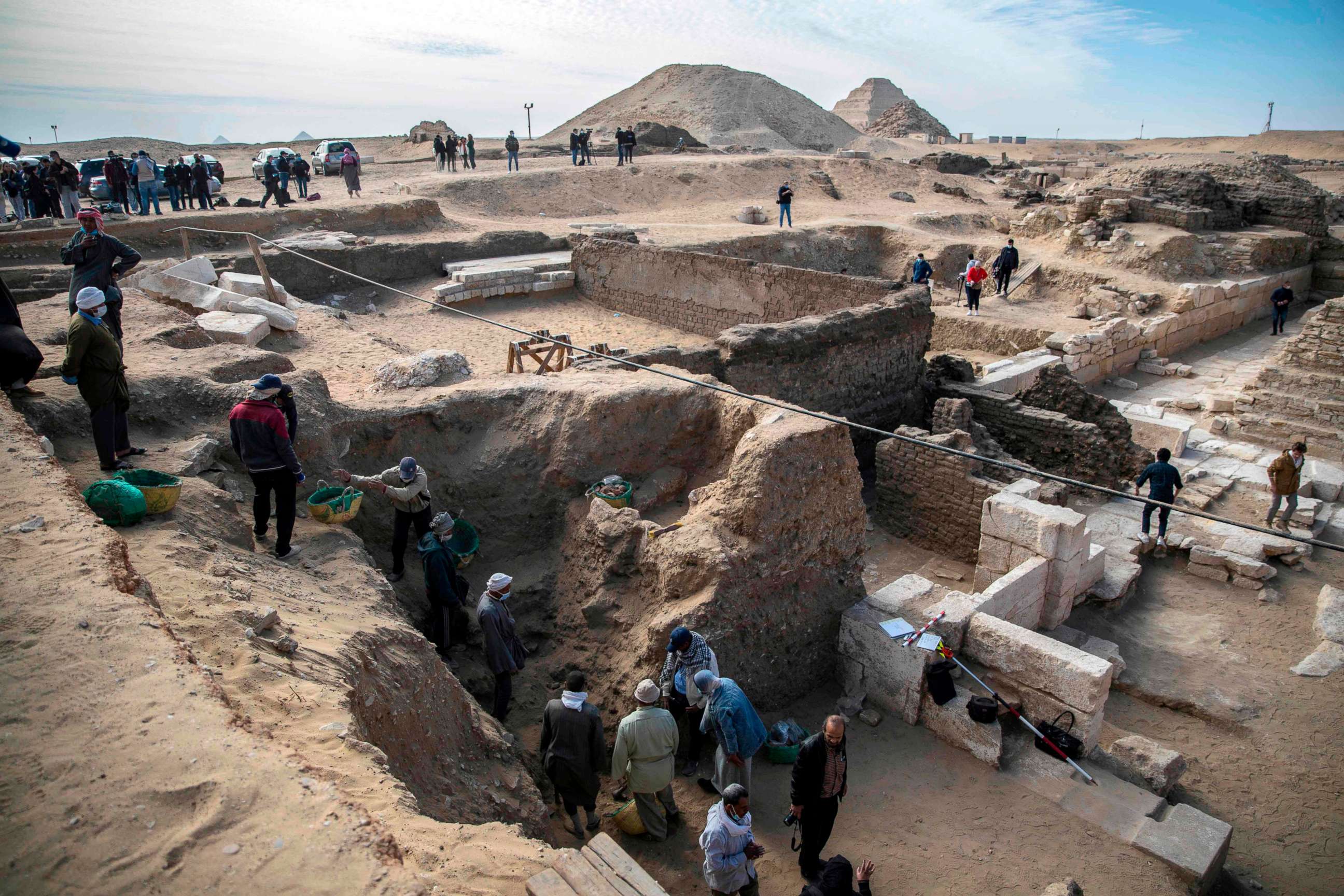 PHOTO: Workers excavate a site during the official announcement of the discovery by an Egyptian archaeological mission of a new trove of treasures at Egypt's Saqqara necropolis south of Cairo, Egypt, Jan. 17, 2021.