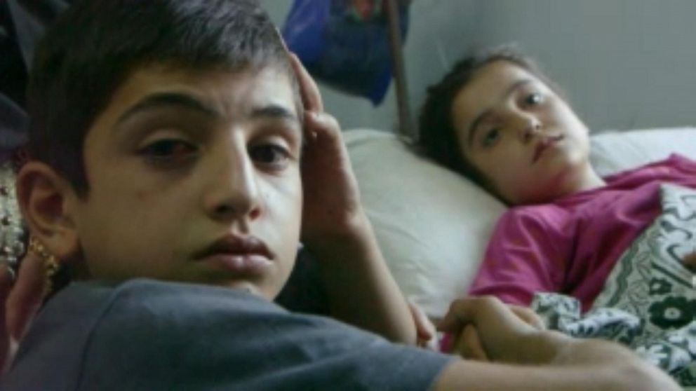 PHOTO: Sara and her brother Ahmed lost their brother Mohammed, who was just 13,  in an artillery explosion.