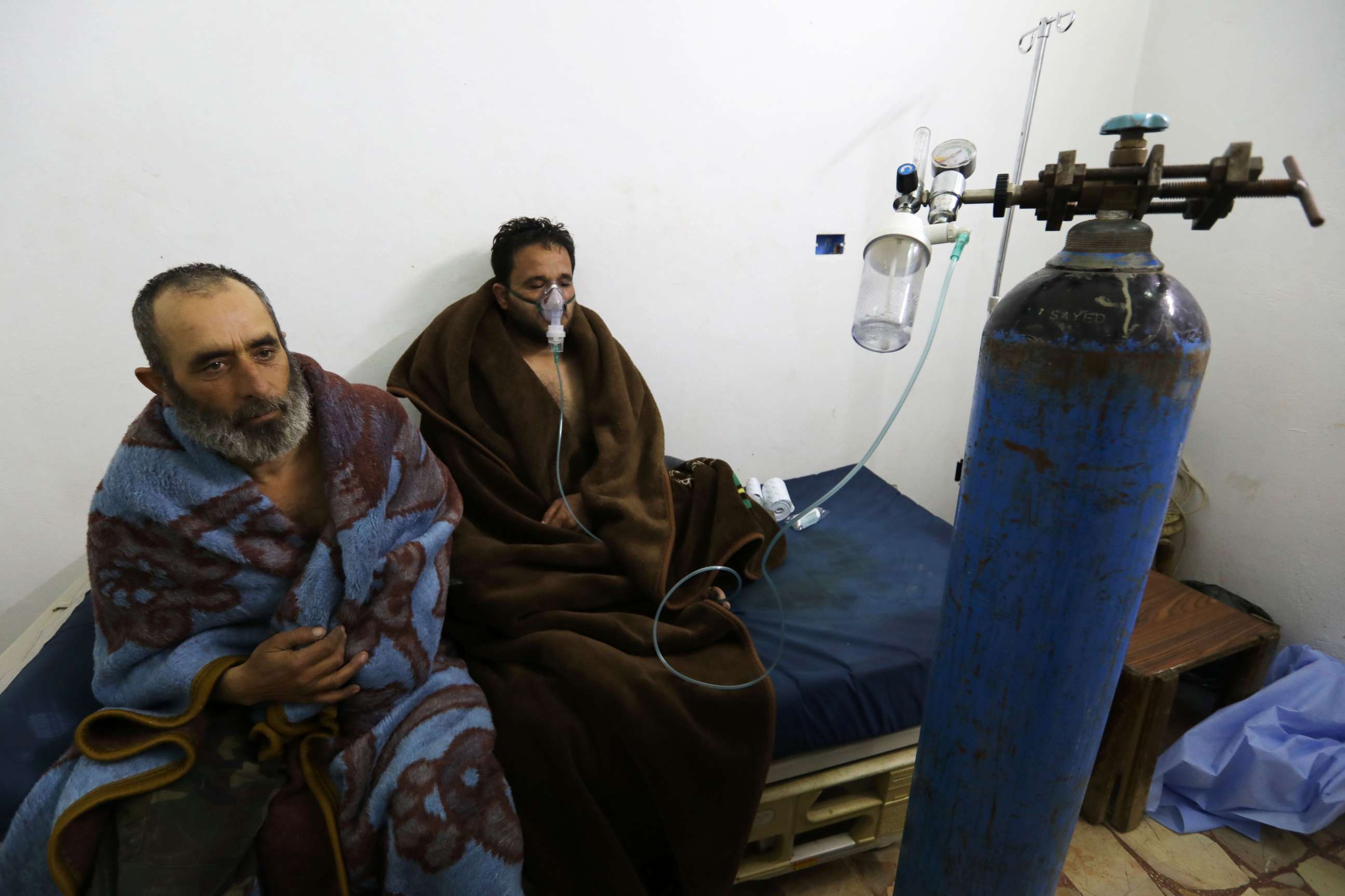 PHOTO: Syrians reportedly suffering from breathing difficulties following Syrian regime air strikes on the northwestern town of Saraqeb, rest at a field hospital in a village on the outskirts of Saraqeb, Feb. 4, 2018.
