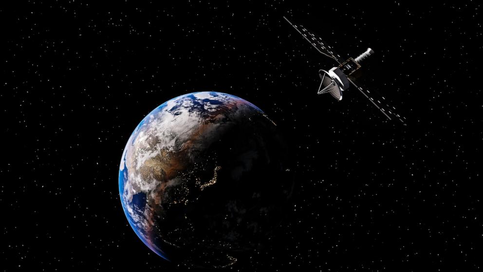 PHOTO: Satellite and earth in undated graphic illustration. 