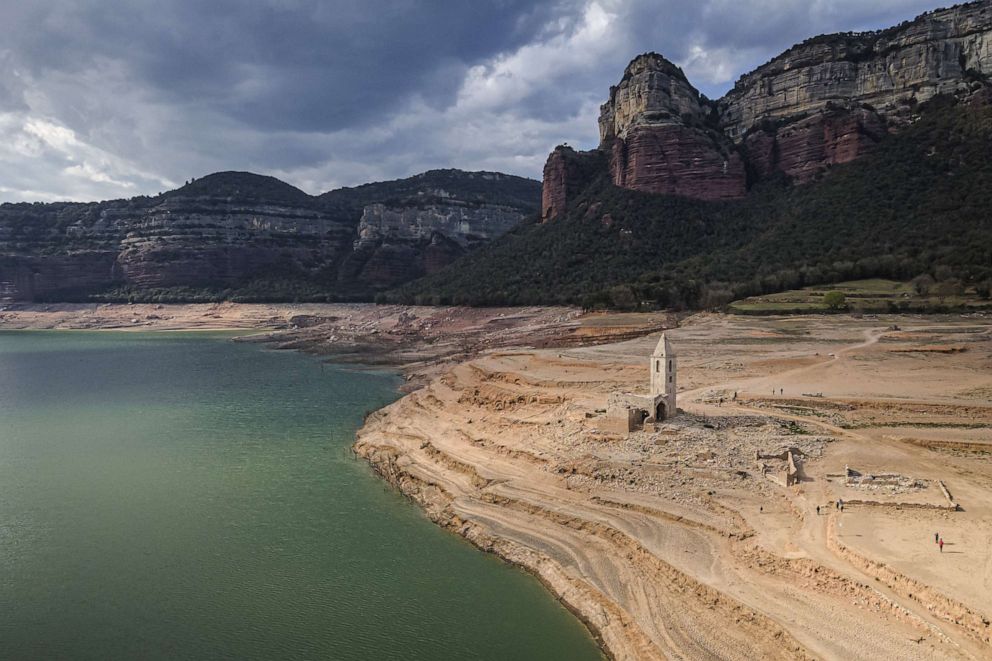 PHOTO: The old church of Sant Romà de Sau, a parish church from the 11th century normally underwater, is perched on dry ground in the Sau reservoir during extreme drought in Vilanova de Sau, Spain, April 7, 2023.