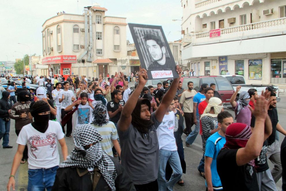 PHOTO: In this file photo, a protester holds a picture of a man said to be held prisoner without trial, during a demonstration in Saudi Arabia's eastern Gulf coast town of Qatif, March 11, 2011.