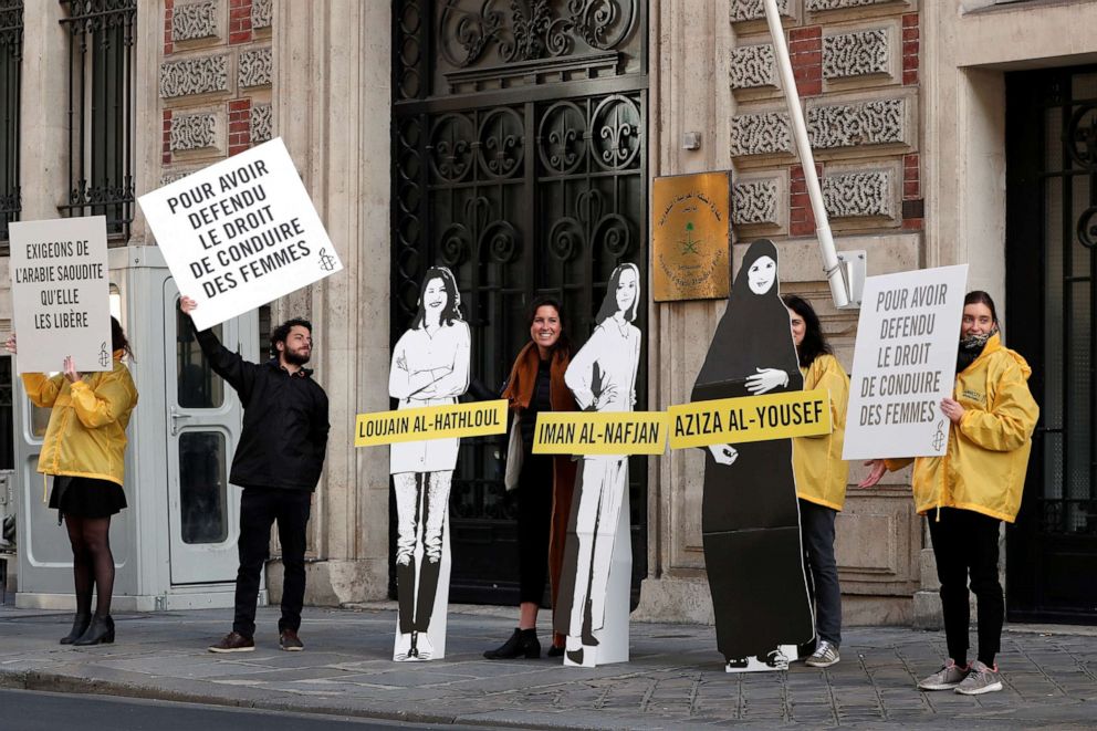 PHOTO: Demonstrators from Amnesty International stage the protest to urge Saudi authorities to release jailed women's rights activists Loujain al-Hathloul, Eman al-Nafjan and Aziza al-Yousef outside the Saudi Arabian Embassy in Paris on March 8, 2019.