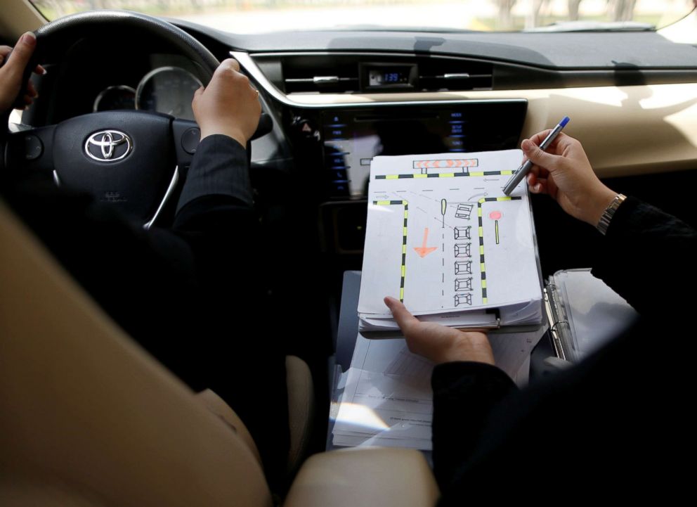 PHOTO: A driving instructor teaches road signs to trainee Amira Abdulgader during a driving lesson at Saudi Aramco Driving Center in Dhahran, Saudi Arabia, June 6, 2018.
