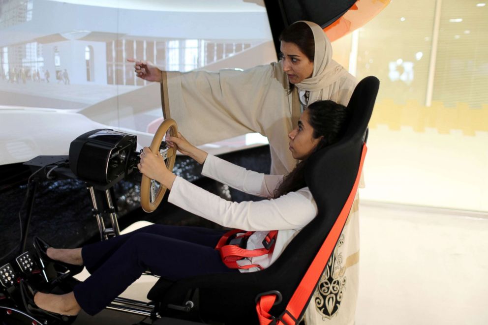 PHOTO: A driving instructor teaches trainee Maria al-Faraj during a driving lesson on a 3D screen at Saudi Aramco Driving Center in Dhahran, Saudi Arabia, June 6, 2018.