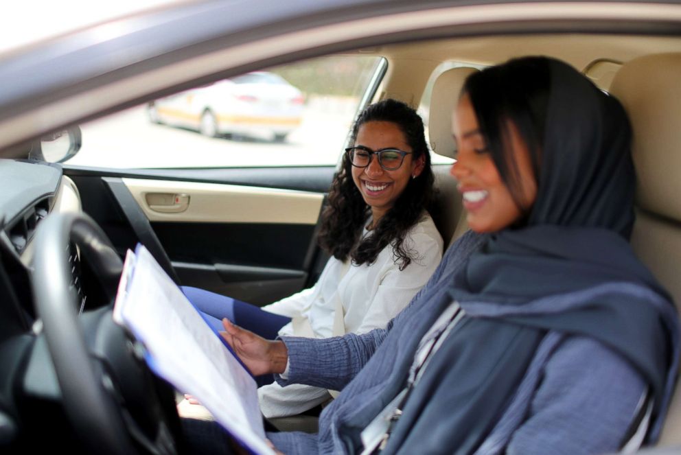 PHOTO: Driving instructor Ahlam al-Somali, right, reads instructions before getting ready to drive with trainee Maria al-Faraj at Saudi Aramco Driving Center in Dhahran, Saudi Arabia, June 6, 2018.