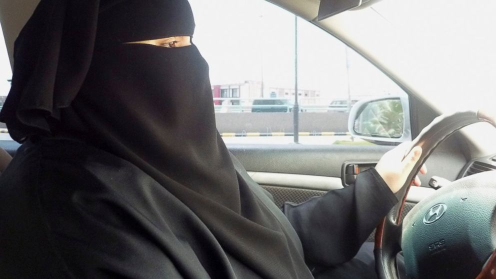 Umm Ibrahim sits behind the wheel of her vehicle as she drives in Riyadh, an act that is banned in Saudi Arabia, June 21, 2011. 