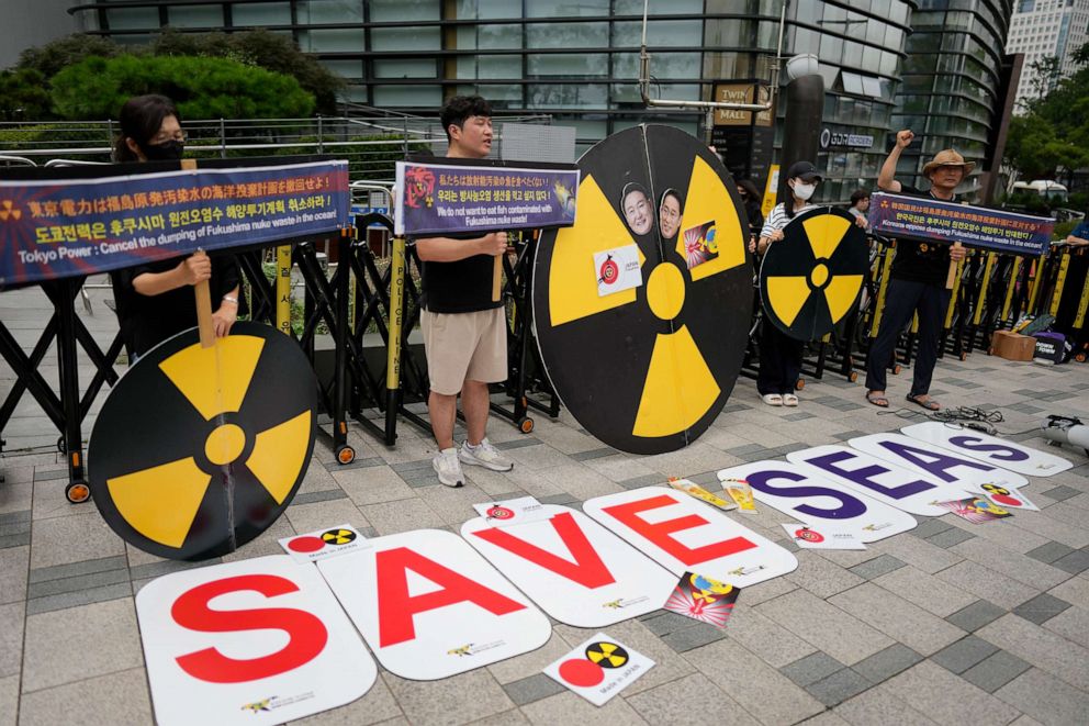 PHOTO: Members of environmental civic groups shout slogans during a rally to denounce the Japanese government's decision to release treated radioactive water outside of a building which houses Japanese Embassy, in Seoul, South Korea, Aug. 22, 2023.