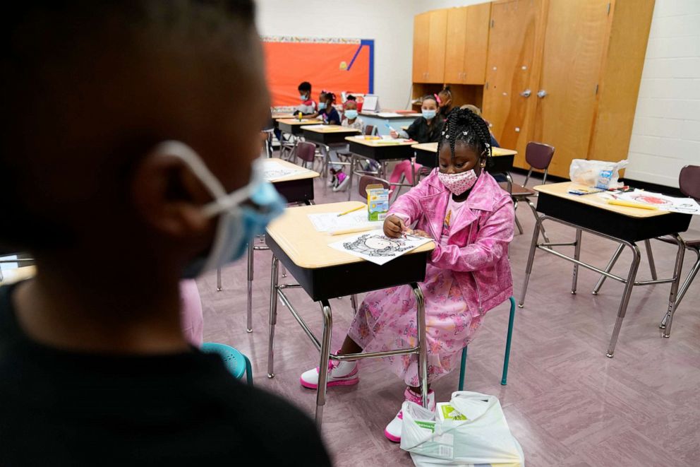 PHOTO: A student colors in a book at Tussahaw Elementary school on Aug. 4, 2021, in McDonough, Ga.