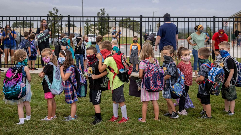 PHOTO: Students line up on the first day of school at Rough Hollow Elementary School in Spicewood, Texas on Sept. 8, 2020.