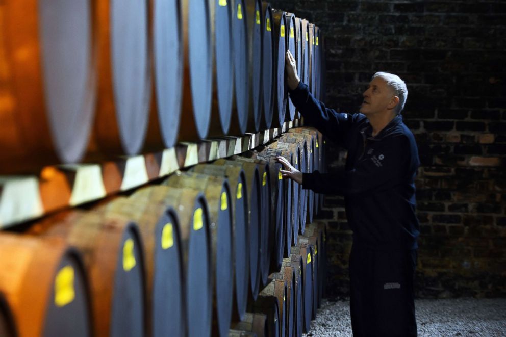 PHOTO: Nigel Baker checks on oak barrels of whisky being stored before bottling, at the Auchentoshan Distillery near Glasgow, Scotland, Feb. 28, 2018.