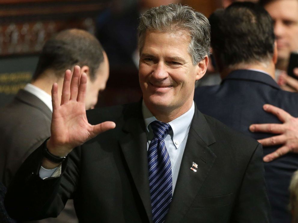 PHOTO: Former Massachusetts Sen. Scott Brown greets people on the floor of the House Chamber at the Statehouse in Boston in this Jan. 8, 2015 file photo.