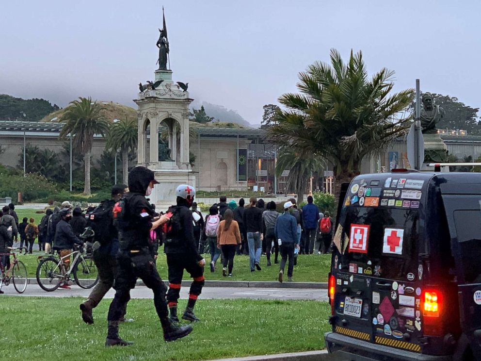 PHOTO: Protesters walk towards the statue of Francis Scott Key at the Golden Gate Park in San Francisco, June 19, 2020.