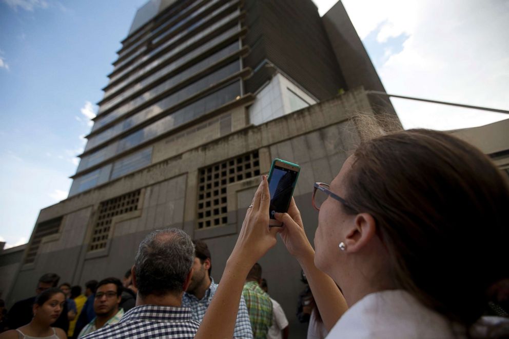 PHOTO: Lawmaker Manuela Bolivar takes photos of the Bolivarian National Security Service (SEBIN) headquarters in Caracas, Venezuela, Oct. 8, 2018. It is alleged that Fernando Alberto Alban Salazar committed suicide while jailed at SEBIN.