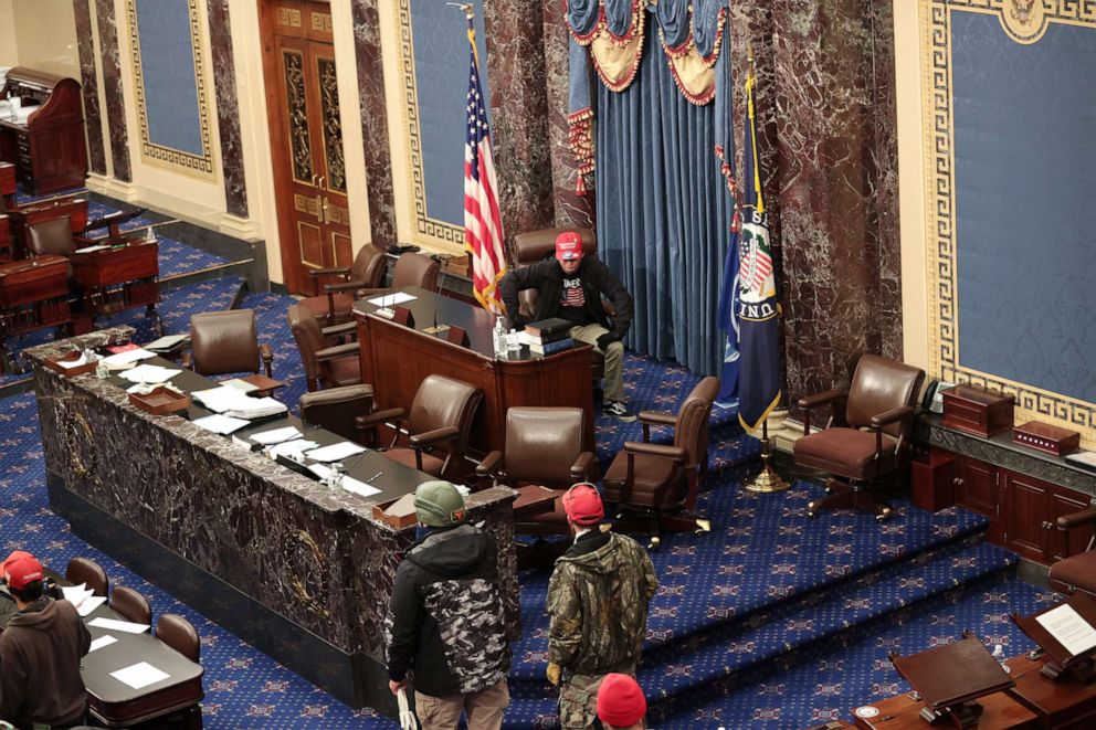 PHOTO: Trump supporters enter the Senate Chamber on Jan. 06, 2021, in Washington, D.C.