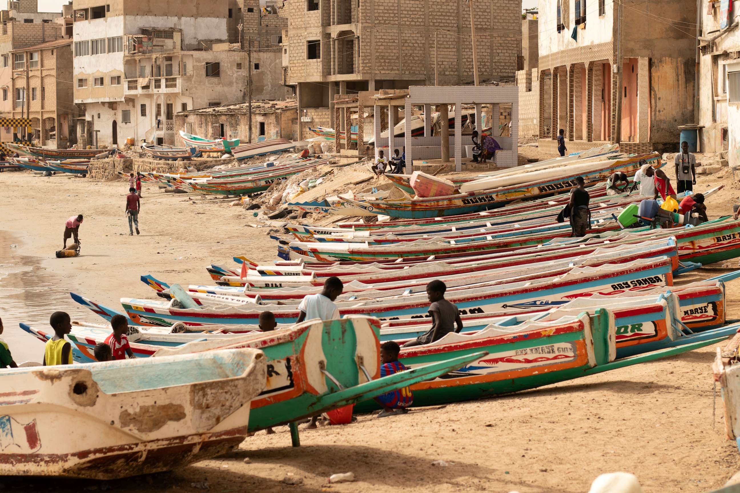 PHOTO: Children play on fishing boats known as a piroguesa in Dakar, Senegal, Saturday June 24, 2023. Large pirogues such as the one found Tuesday, Aug. 15, 2023, near Cabo Verde are used in migrant crossings from Senegal to Spain.