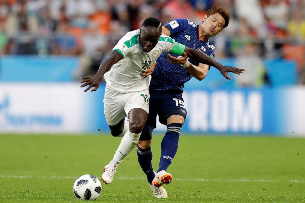 PHOTO: Senegal's Ismaila Sarr, left, and Japan's Hiroki Sakai fight for the ball during the group H match between Japan and Senegal at the 2018 soccer World Cup at the Yekaterinburg Arena in Yekaterinburg, Russia, June 24, 2018.