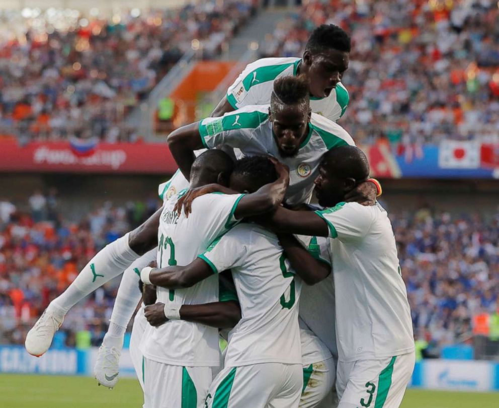 PHOTO: Senegal's players celebrate their side's opening goal during the group H match between Japan and Senegal at the 2018 soccer World Cup at the Yekaterinburg Arena in Yekaterinburg , Russia, June 24, 2018. 