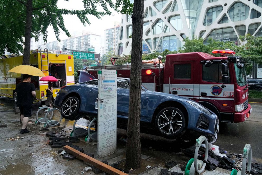 PHOTO: A vehicle sits damaged on a road after floating in heavy rainfall in Seoul, South Korea, on Aug. 9, 2022.
