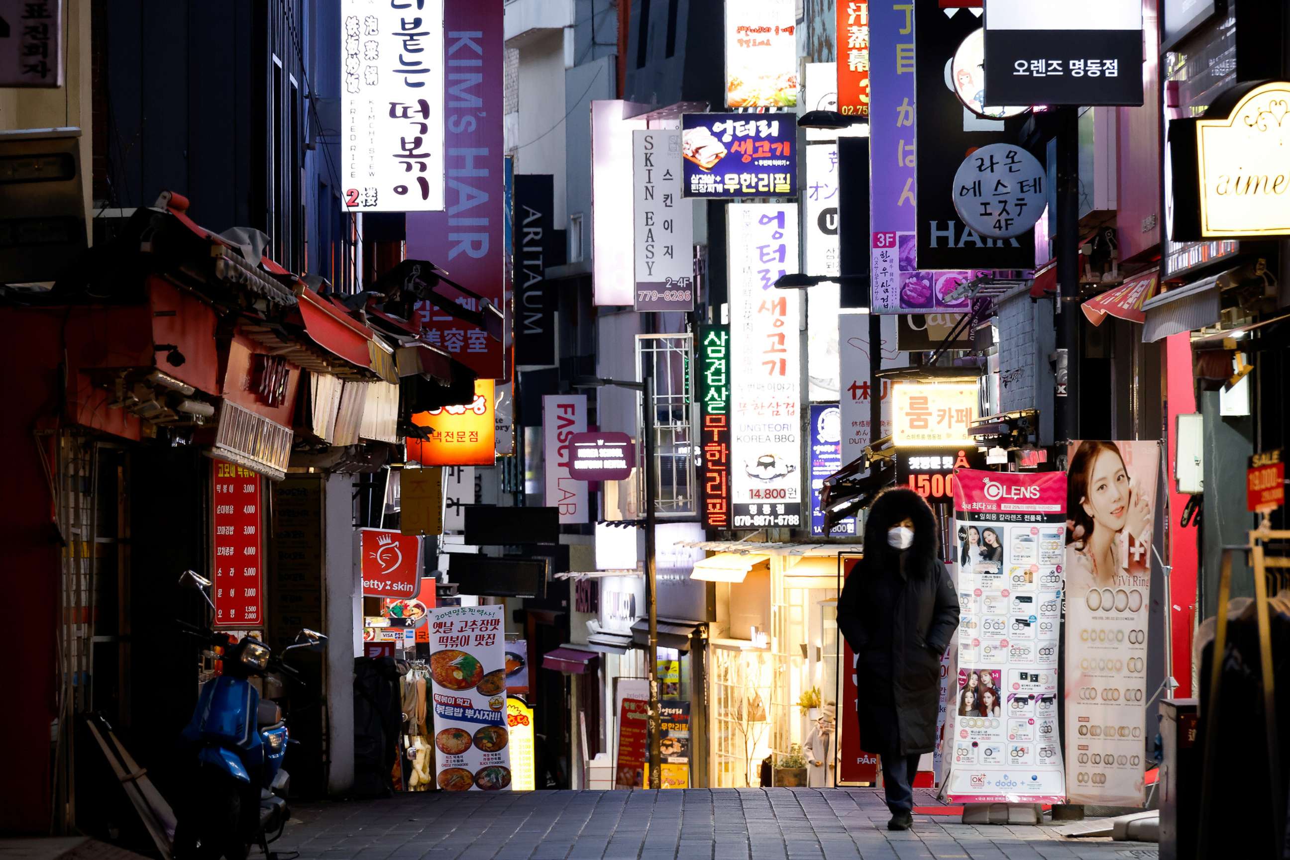 PHOTO: A previously crowded shopping street is nearly empty after heightened social distancing rules were enforced amid the COVID-19 pandemic in Seoul, South Korea, Dec. 8, 2020.