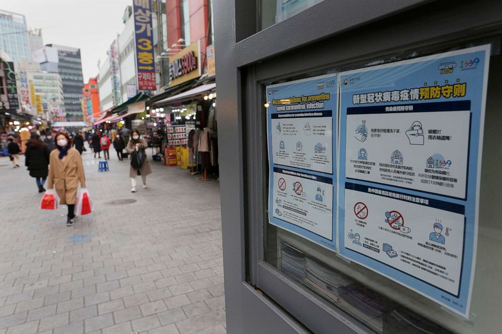 PHOTO: Posters on precautions against the coronavirus are displayed at a shopping street in Seoul, South Korea, Dec. 9, 2020. South Korea is experiencing a resurgence of the coronavirus.