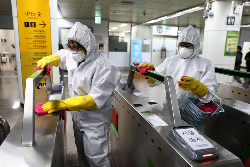 PHOTO: Disinfection professionals wearing protective gear spray anti-septic solution against the novel coronavirus at a subway station in Seoul, South Korea, on Feb. 28, 2020.
