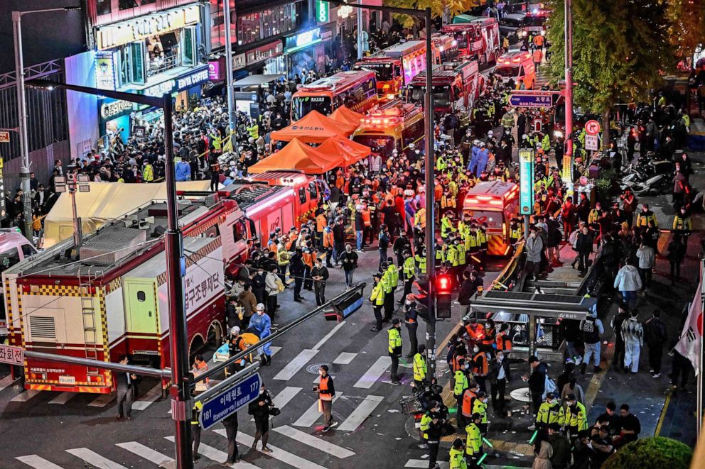 PHOTO: Onlookers, police and medical staff gather after dozens were injured in a stampede, after people crowded into narrow streets in the city's Itaewon neighbourhood to celebrate Halloween, in Seoul, on Oct. 30, 2022.