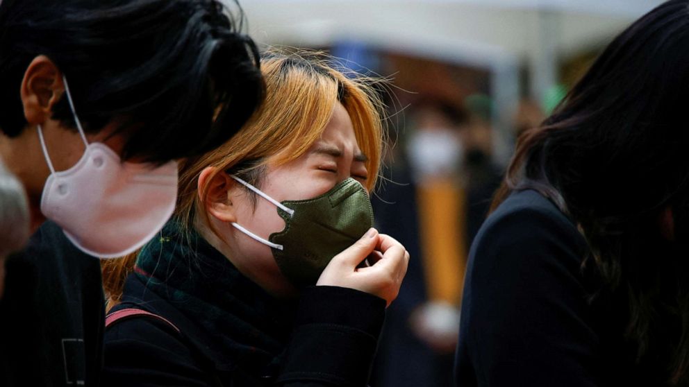 PHOTO: A person mourns at a group memorial for the victims of the Oct. 30 Halloween stampede on Oct. 31, 2022 in Seoul, South Korea.