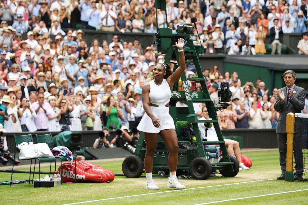 PHOTO:Runner up Serena Williams of U.S. acknowledges the spectators as she walks up to receive her trophy following her Ladies' Singles final against Simona Halep of Romania during Day twelve of The Championships  in London, July 13, 2019.