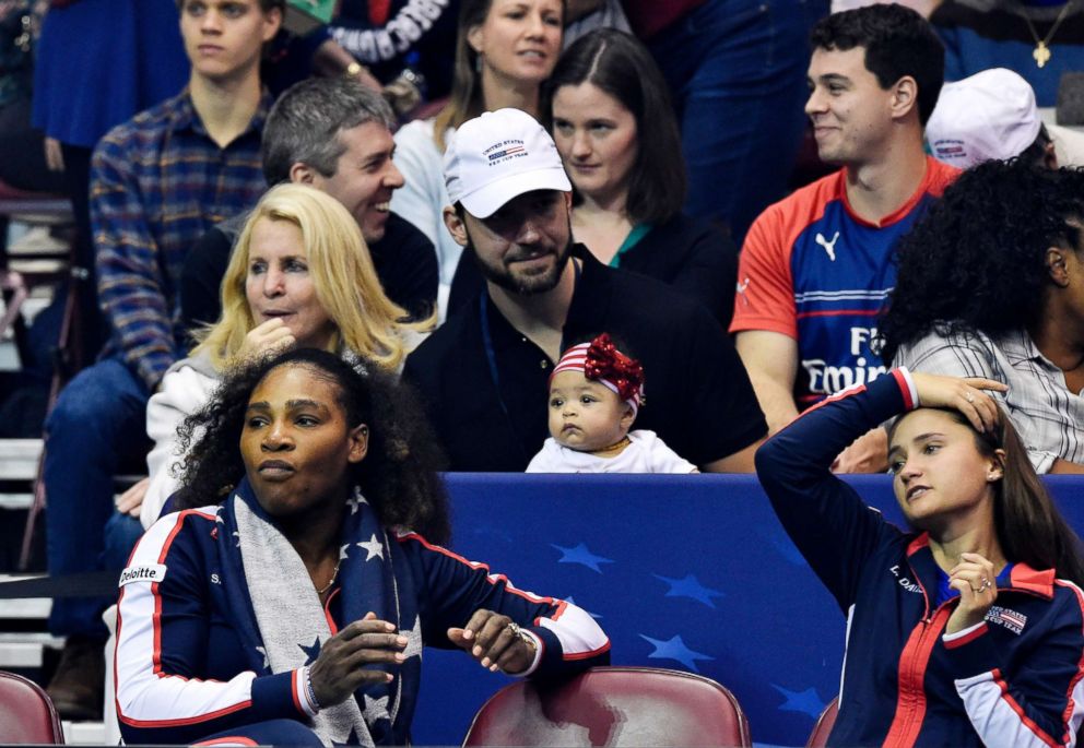 PHOTO: Serena Williams, bottom left, along with her husband Alexis Ohanian and their daughter Alexis Olympia, center, watch the action during the first round of the 2018 Fed Cup at US Cellular Center, Feb. 10, 2018, in Asheville, N.C.