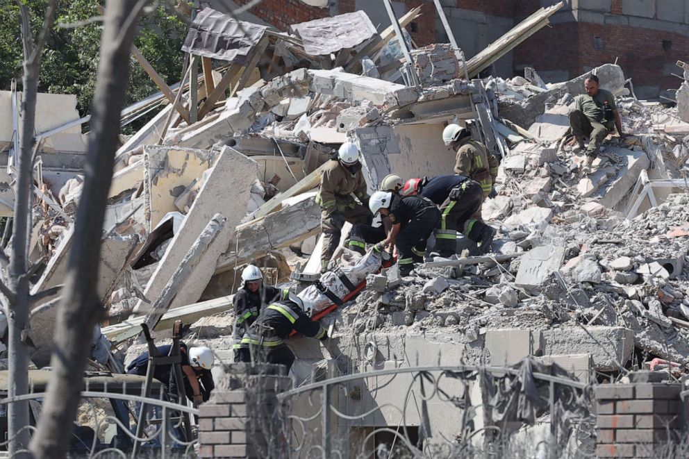 PHOTO: Rescuers evacuate a body from a building destroyed by a missile strike in the Ukrainian town of Sergiyvka, near Odessa, killing at least 18 people and injuring 30, on July 1, 2022.