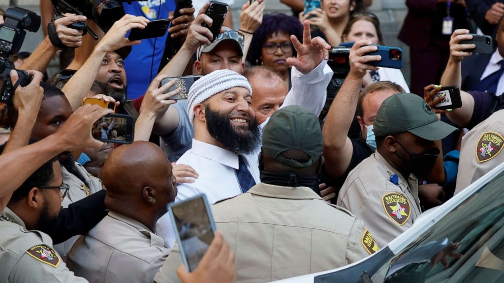 PHOTO: Adnan Syed, whose case was chronicled in the hit podcast "Serial" smiles and waves as he heads to a vehicle after exiting the courthouse after a judge overturned Syed's 2000 murder conviction during a hearing in Baltimore, Sept. 19, 2022.