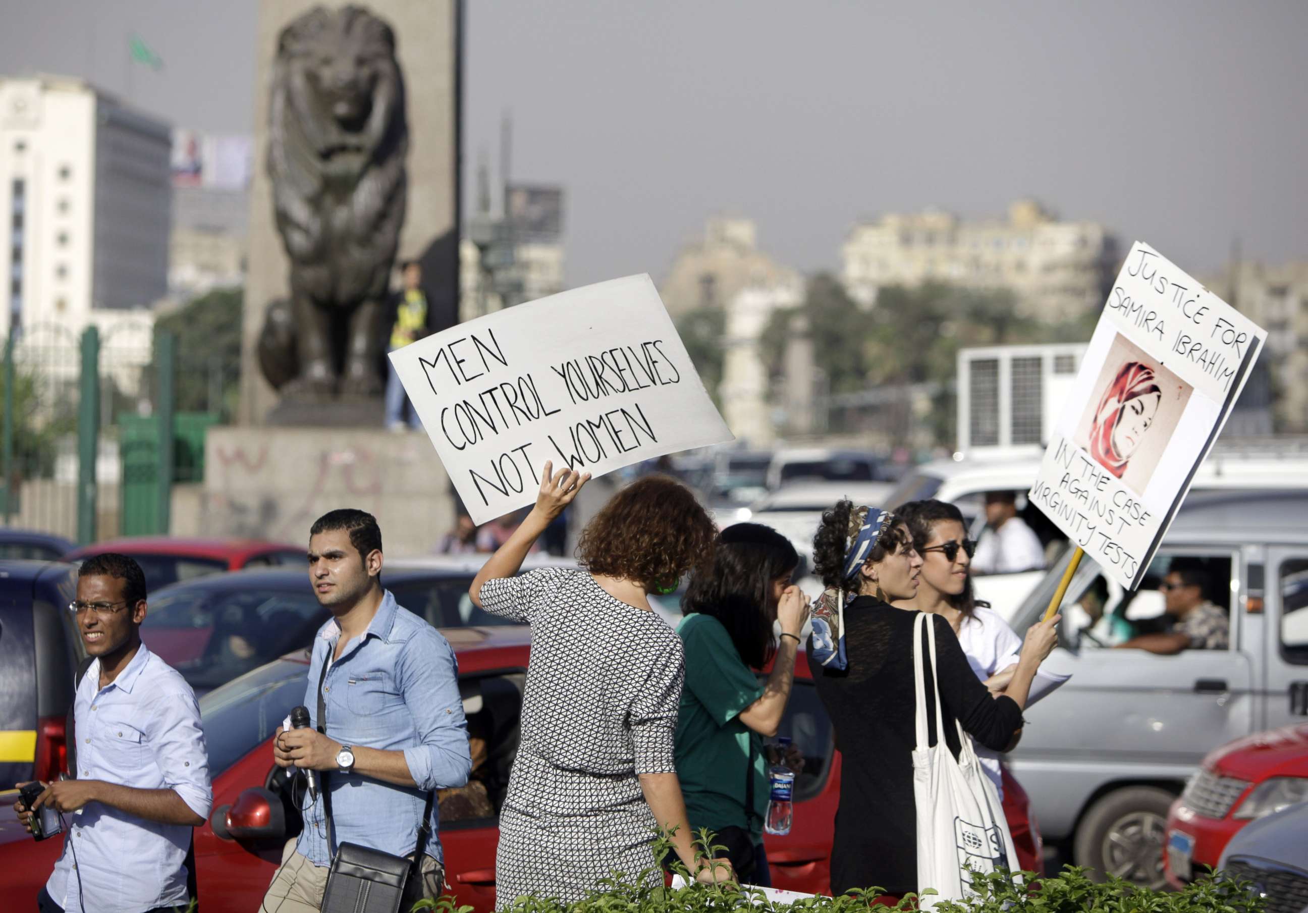 PHOTO: Egyptian women hold signs during a protest against sexual harassment in Cairo, Egypt, June 14, 2014.