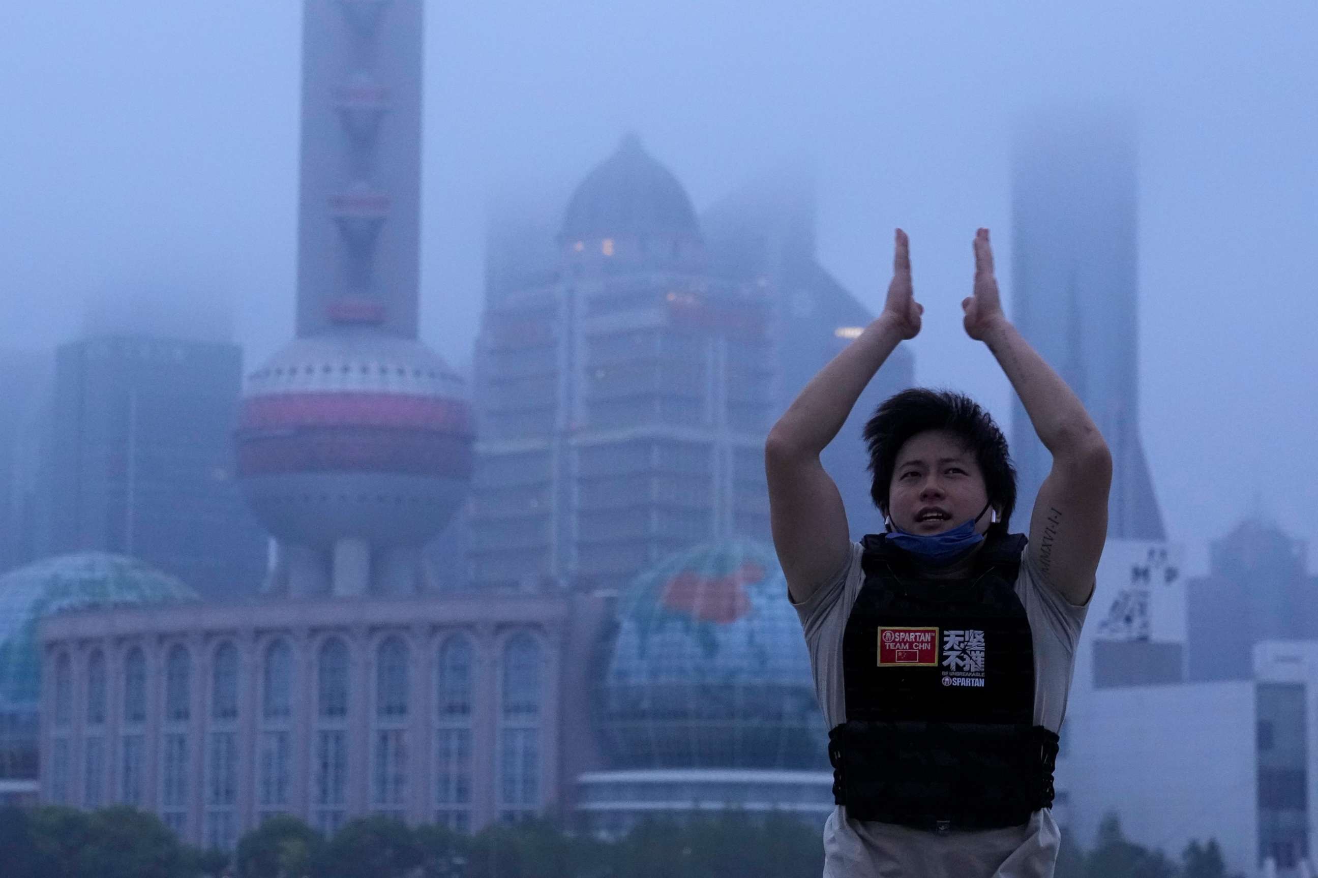 PHOTO: A Shanghai resident exercises along the bund as day breaks, June 1, 2022.