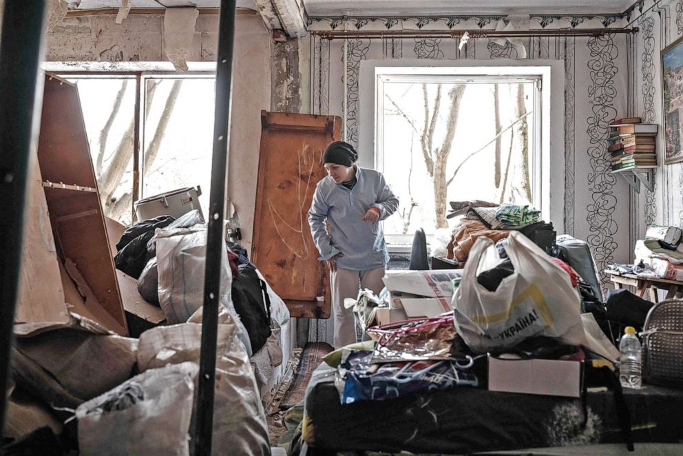 PHOTO: A woman cleans a room at an apartment damaged by a missile explosion in Kramatorsk, eastern Ukraine, on May 5, 2022.