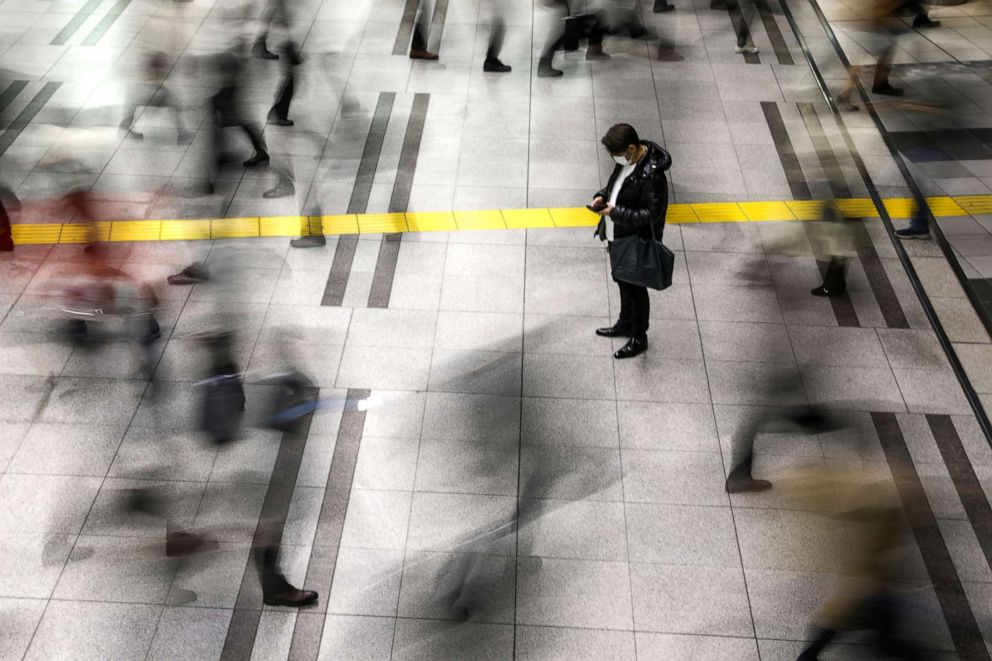 PHOTO: A man wearing a protective face mask, following an outbreak of the novel coronavirus, stands at the Shinagawa station in Tokyo, Japan, Feb. 28, 2020.