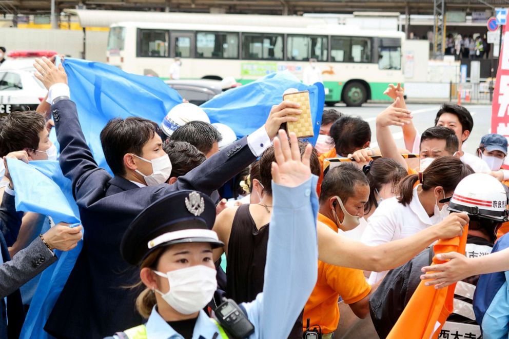 PHOTO: People react after gunshots in Nara, western Japan Friday, July 8, 2022. Japan’s former Prime Minister Shinzo Abe was in heart failure after apparently being shot during a campaign speech Friday in western Japan, NHK public television said Friday.