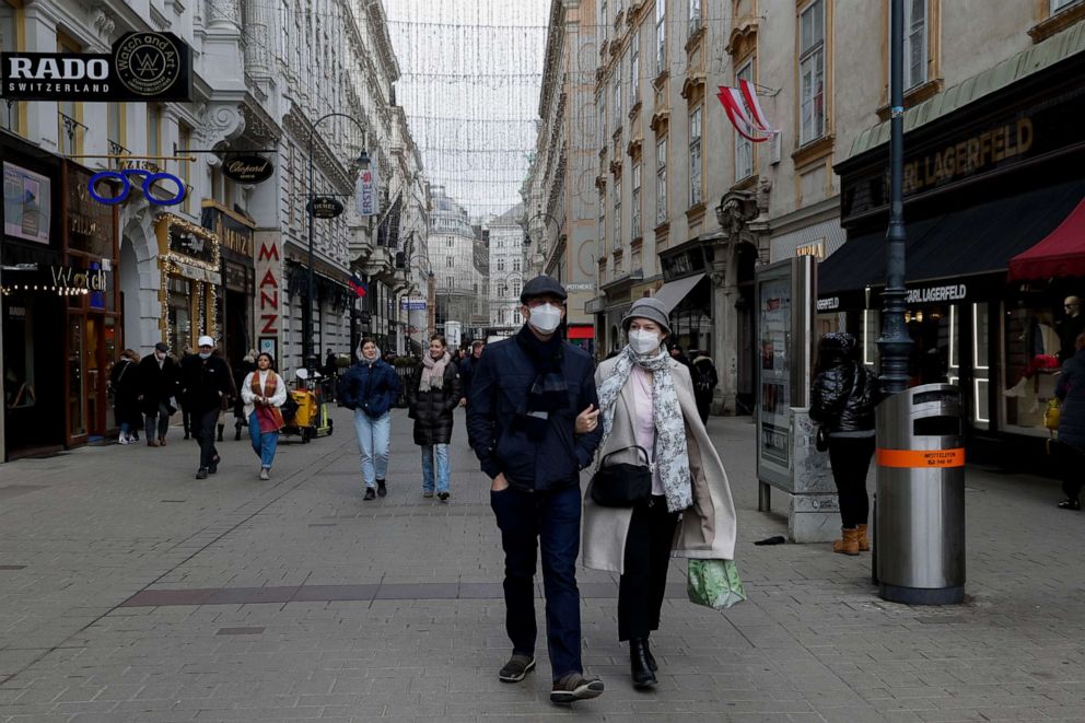 PHOTO: People walk over through a shopping street in Vienna, Austria, on Nov. 19, 2021.