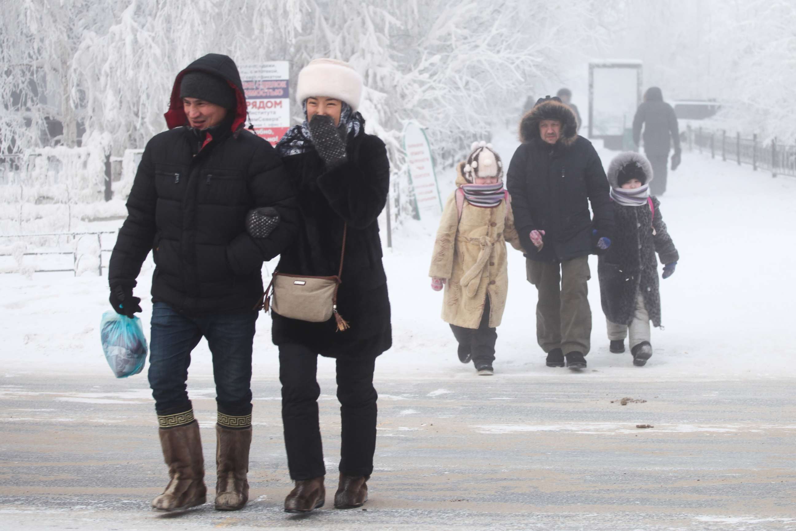 PHOTO: Local residents walk along a city street in Yakutsk, Russia, Jan. 16, 2018.