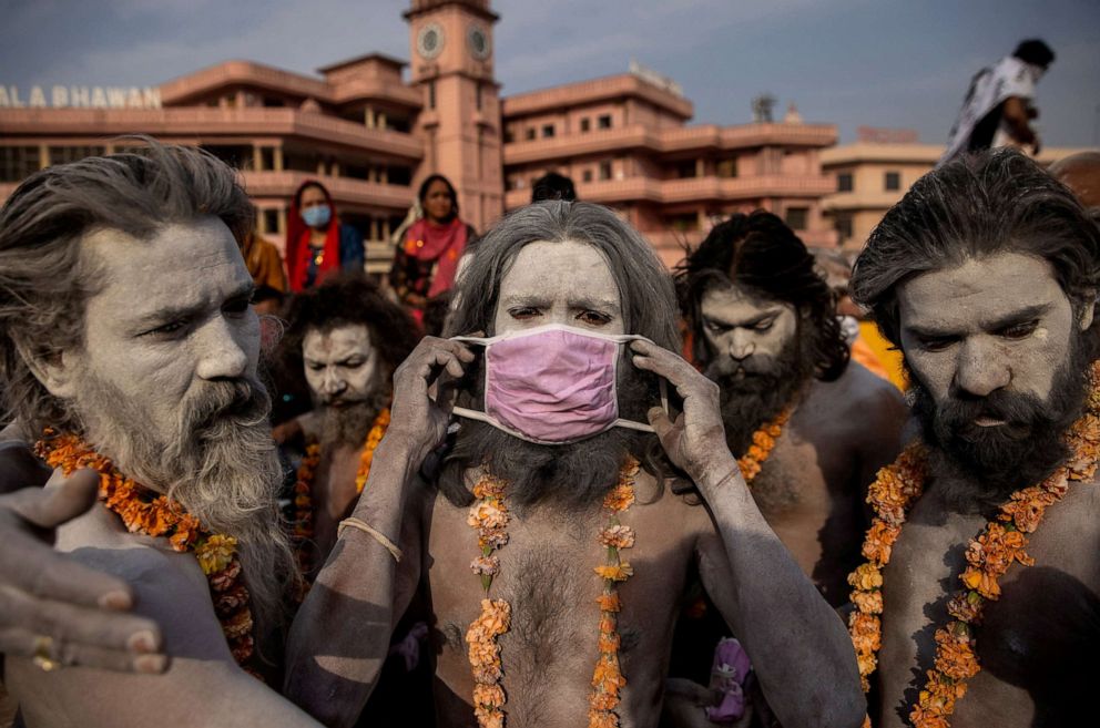PHOTO: A Hindu holy man wears a mask before the procession to the Ganges river during Shahi Snan at "Kumbh Mela", or the Pitcher Festival, during the COVID-19 pandeminc, in Haridwar, India, April 12, 2021.