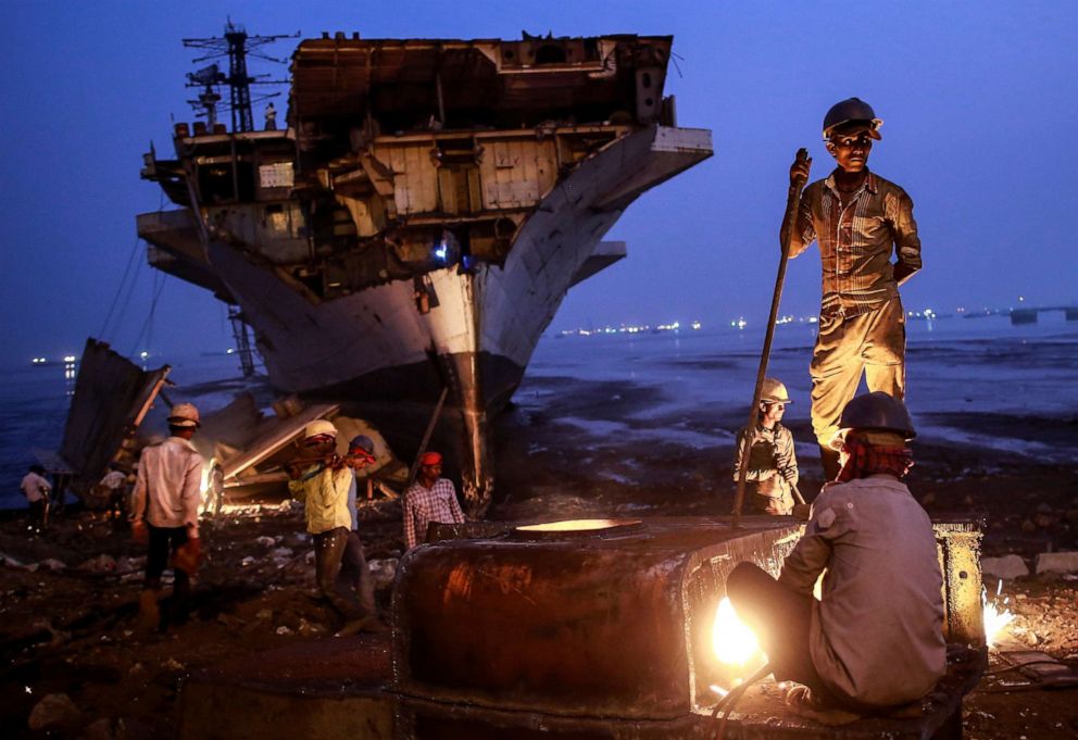 PHOTO: A worker uses metal cutter to dismantled parts of decommissioned Indian Navy Ship INS Vikrant at a ship breaking yard in Mumbai, Nov. 24, 2014.