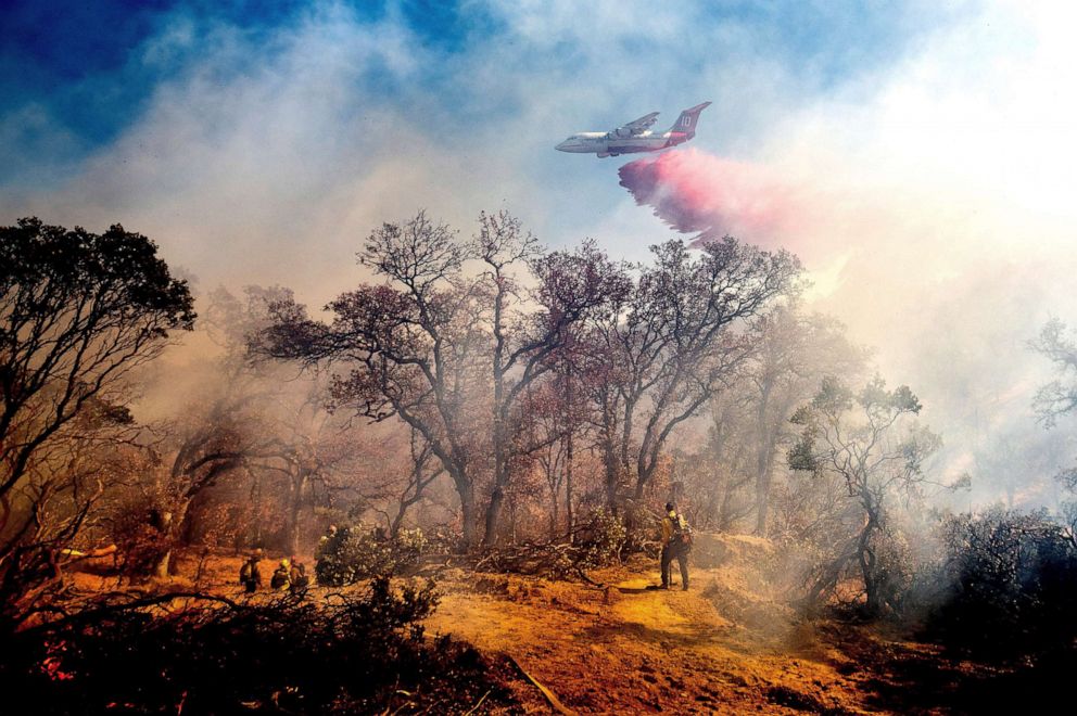 PHOTO: An air tanker drops retardant on the Olinda Fire burning in Anderson, Calif., Oct. 25, 2020.