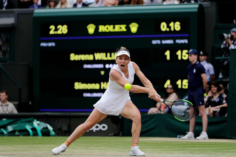 PHOTO: Simona Halep of Romania plays a backhand in her Ladies' Singles final against Serena Williams of the U.S. during Day twelve of The Wimbledon Championships in London, July 13, 2019.