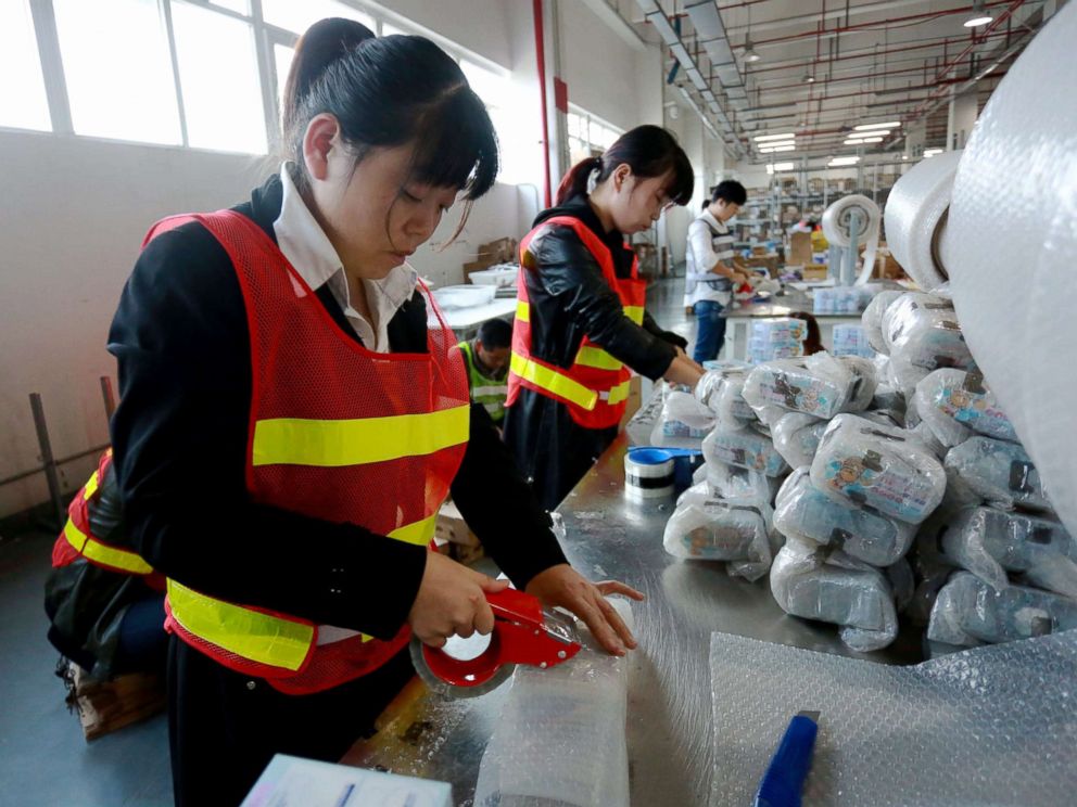 PHOTO: Staff members of a cross-border e-commerce company package products in Ningbo, China, Nov. 8, 2017.